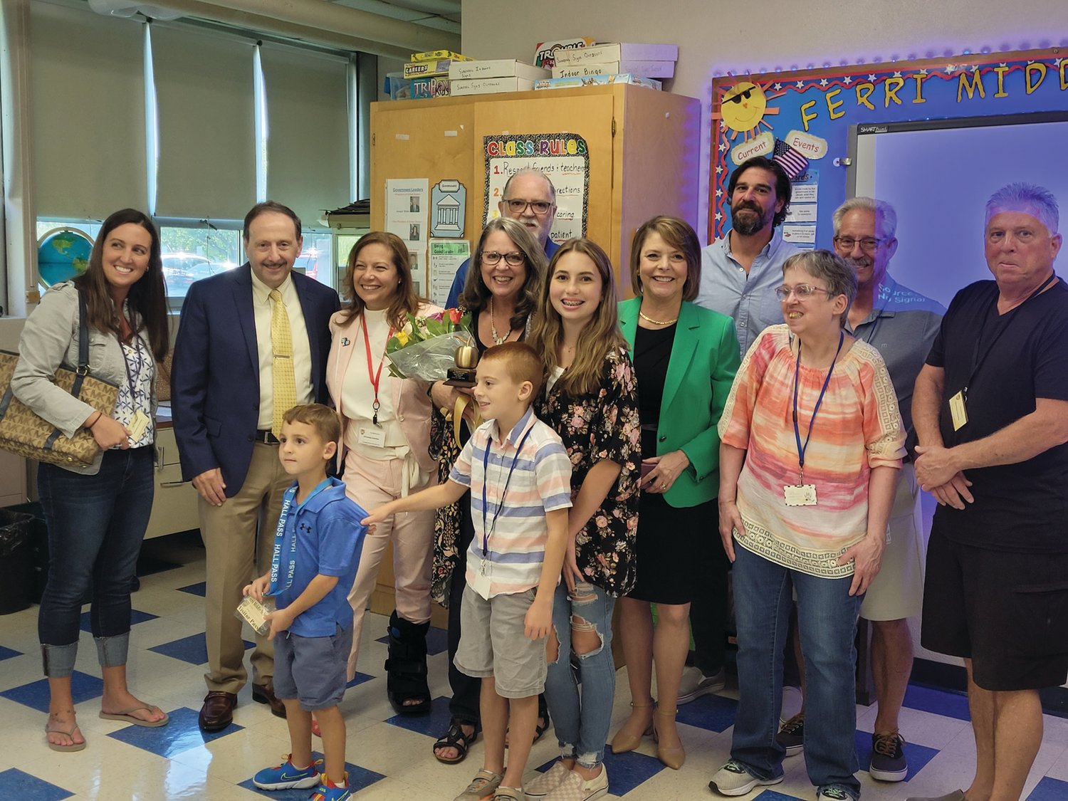 FAMILY & FRIENDS: Ferri Middle School Teacher Joan Wright’s family and friends and school administrators helped to fill her classroom last Thursday after she was awarded a “Golden Apple.”